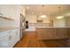 Modern kitchen featuring stainless steel appliances, white cabinetry, a wooden island and tile backsplash at 10586 Jacks Way, Indianapolis, IN 46234