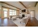 Bright and airy living room features hardwood floors, fireplace, and large windows at 10586 Jacks Way, Indianapolis, IN 46234