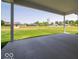 Covered patio with concrete flooring overlooking the expansive backyard at 10586 Jacks Way, Indianapolis, IN 46234