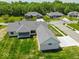 Rear view of the house, highlighting the covered patio and the surrounding trees at 10586 Jacks Way, Indianapolis, IN 46234