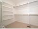 New walk-in closet with carpet and metal racks and shelves at 10586 Jacks Way, Indianapolis, IN 46234