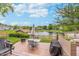 Beautiful backyard view with a pond and fountain, creating a serene outdoor space at 10673 Misty Hollow Ln, Fishers, IN 46038