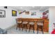 Basement bar area with seating, ideal for enjoying drinks and socializing at 10673 Misty Hollow Ln, Fishers, IN 46038
