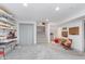 Finished basement with lots of open space, featuring built in shelves and ample storage at 10673 Misty Hollow Ln, Fishers, IN 46038