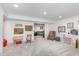 Spacious basement area perfect for entertainment and relaxation, featuring comfortable seating at 10673 Misty Hollow Ln, Fishers, IN 46038