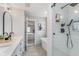 Beautiful bathroom with double vanity, walk-in shower with tile, and soaking tub with black fixtures at 10673 Misty Hollow Ln, Fishers, IN 46038