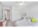 Bright bedroom with white decor, closet with sliding doors, and ceiling fan at 10673 Misty Hollow Ln, Fishers, IN 46038