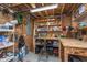 Basement workshop with workbench and shelving, perfect for DIY projects at 10673 Misty Hollow Ln, Fishers, IN 46038