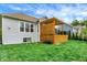 Home's exterior featuring a wood deck with a pergola and grassy backyard at 1071 Serenity Ct, Carmel, IN 46280