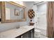 Stylish bathroom with a wood-framed mirror, modern vanity, and shower at 1071 Serenity Ct, Carmel, IN 46280