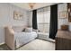 Cozy bedroom with a tufted daybed and a decorative chandelier at 1071 Serenity Ct, Carmel, IN 46280