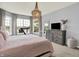 Bright bedroom with large windows, a comfortable bed, and a view of a tranquil lake, creating a serene atmosphere at 1071 Serenity Ct, Carmel, IN 46280