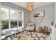 Charming room featuring a whimsical chandelier and a patterned accent rug at 1071 Serenity Ct, Carmel, IN 46280