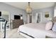 Bedroom featuring a large bed, dresser with TV, and elegant lighting, creating a cozy and stylish retreat at 1071 Serenity Ct, Carmel, IN 46280