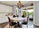 Dining area featuring a decorative chandelier and sliding glass doors leading to a deck with scenic views at 1071 Serenity Ct, Carmel, IN 46280