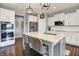 Bright kitchen features a large island, stainless steel appliances, and white cabinetry at 1071 Serenity Ct, Carmel, IN 46280