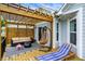 Covered patio with outdoor furniture, a lounge chair, and sliding glass doors to the home at 1071 Serenity Ct, Carmel, IN 46280