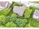 Expansive aerial view of a well-maintained home with a deck, screened porch, and lush green backyard at 10888 Weston Dr, Carmel, IN 46032