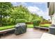 Spacious back deck with built-in seating and outdoor grill, perfect for entertaining at 10888 Weston Dr, Carmel, IN 46032