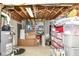 Unfinished basement used for storage featuring concrete floor, exposed ceiling, and utilities at 10888 Weston Dr, Carmel, IN 46032