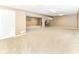 Finished basement features neutral carpet and ample open space at 10888 Weston Dr, Carmel, IN 46032