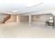 Finished basement features carpet, stairs, and open area at 10888 Weston Dr, Carmel, IN 46032