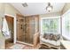 Bathroom features tiled shower, window, and seating area at 10888 Weston Dr, Carmel, IN 46032