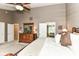 Large primary bedroom with vaulted ceiling, dresser, and ensuite bathroom at 10888 Weston Dr, Carmel, IN 46032