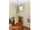 Grand foyer with hardwood floors, a chandelier, and a decorative front door, offering a welcoming entrance at 10888 Weston Dr, Carmel, IN 46032