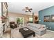 Inviting living room with a brick fireplace, sliding doors to the patio, and an open flow to the dining area at 10888 Weston Dr, Carmel, IN 46032