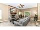 Cozy living room featuring a brick fireplace, sliding doors to the backyard, and comfortable seating at 10888 Weston Dr, Carmel, IN 46032