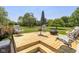 Backyard featuring a wooden deck with outdoor seating and a fire pit at 1135 W Wildflower Ct, Mooresville, IN 46158