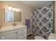 Bathroom featuring a vanity with a sink, mirror, and shower with patterned curtain at 1135 W Wildflower Ct, Mooresville, IN 46158