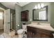 Well-maintained bathroom with a vanity, updated fixtures, and a glass-door shower at 1135 W Wildflower Ct, Mooresville, IN 46158