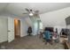 Bedroom featuring a desk, computer, TV, ceiling fan and an open door at 1135 W Wildflower Ct, Mooresville, IN 46158