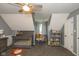 Well-lit bedroom with a crib, curtains, toys, and a bookshelf at 1135 W Wildflower Ct, Mooresville, IN 46158