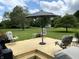New deck with outdoor seating and umbrella is perfect for entertaining and enjoying the backyard at 1135 W Wildflower Ct, Mooresville, IN 46158
