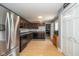 Bright kitchen featuring stainless steel appliances, dark cabinets, and ample counter space at 1135 W Wildflower Ct, Mooresville, IN 46158