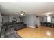 Open-concept living room with a fireplace, ceiling fan, and recessed lighting at 1135 W Wildflower Ct, Mooresville, IN 46158