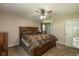 Spacious main bedroom with a ceiling fan, large window, and closet at 1135 W Wildflower Ct, Mooresville, IN 46158