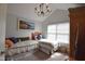 Cozy bedroom with two twin beds, a window, and a ceiling fan at 1150 Extraordinary Trl, Greenfield, IN 46140