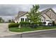 Beautifully landscaped lawn featuring lush green grass and mature trees on an overcast day at 1150 Extraordinary Trl, Greenfield, IN 46140