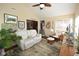 Cozy living room with neutral walls, comfortable seating, and leafy green plants at 1150 Extraordinary Trl, Greenfield, IN 46140