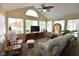 Bright living room with vaulted ceilings, a ceiling fan, and large windows with stained glass at 1150 Extraordinary Trl, Greenfield, IN 46140