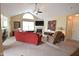 Spacious living room with high ceilings, fireplace, and large window at 1150 Extraordinary Trl, Greenfield, IN 46140