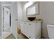 Bathroom featuring a modern vanity with granite countertop and vessel sink at 1150 W 30Th St, Indianapolis, IN 46208