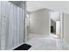 Bright bathroom featuring tile floors, shower with glass, and a vanity at 1150 W 30Th St, Indianapolis, IN 46208