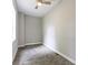 Cozy bedroom with neutral carpet, gray walls, a ceiling fan, and plenty of natural light at 1150 W 30Th St, Indianapolis, IN 46208