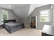 Bedroom with gray walls, carpet, and a neutral bed with a bookshelf at 1150 W 30Th St, Indianapolis, IN 46208