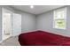 Bedroom with natural lighting, neutral colored walls, and a comfortable bed at 1150 W 30Th St, Indianapolis, IN 46208